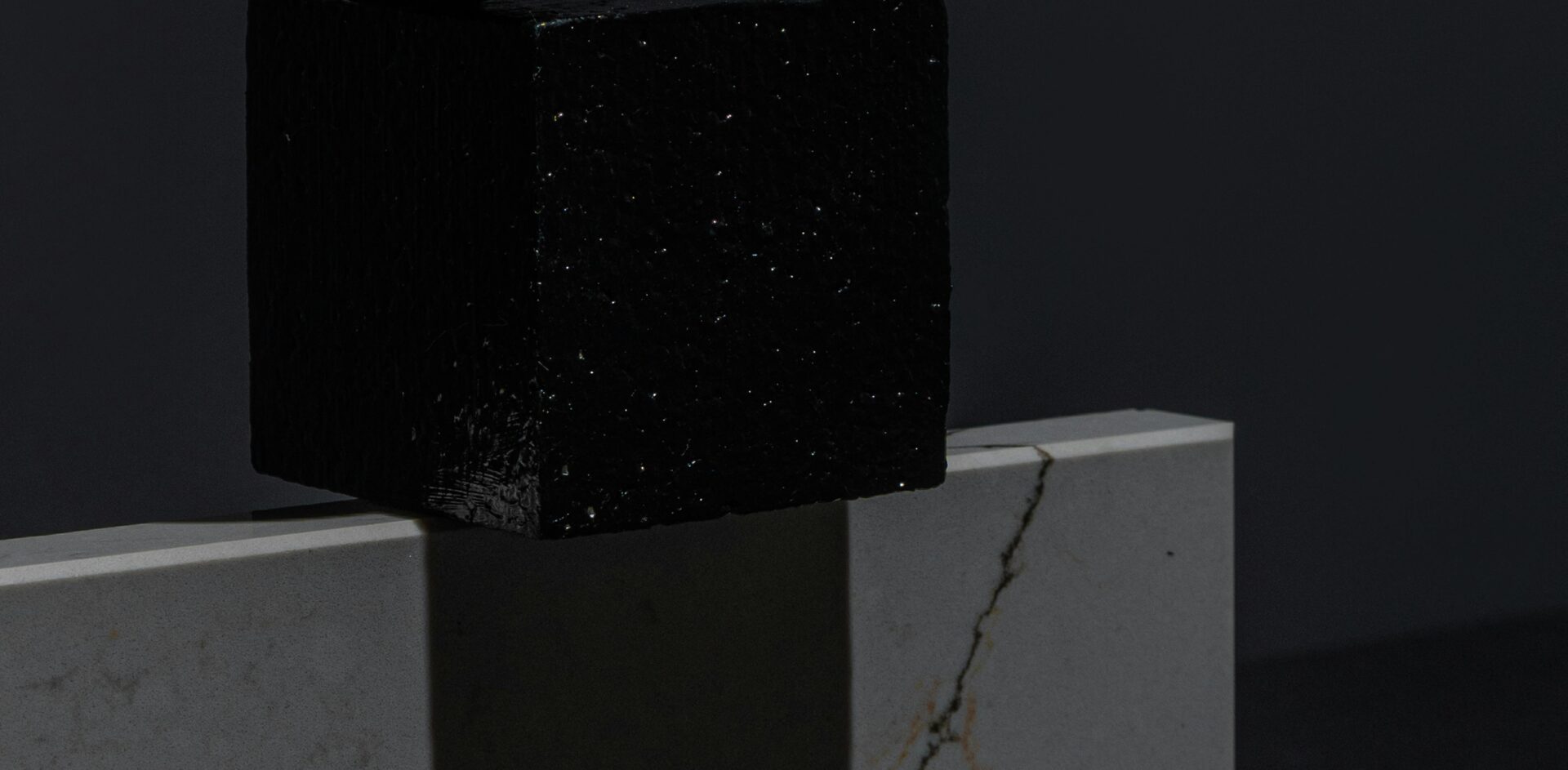 Photo by Mikhail Nilov: https://www.pexels.com/photo/geometric-shape-objects-on-a-black-surface-7828707/